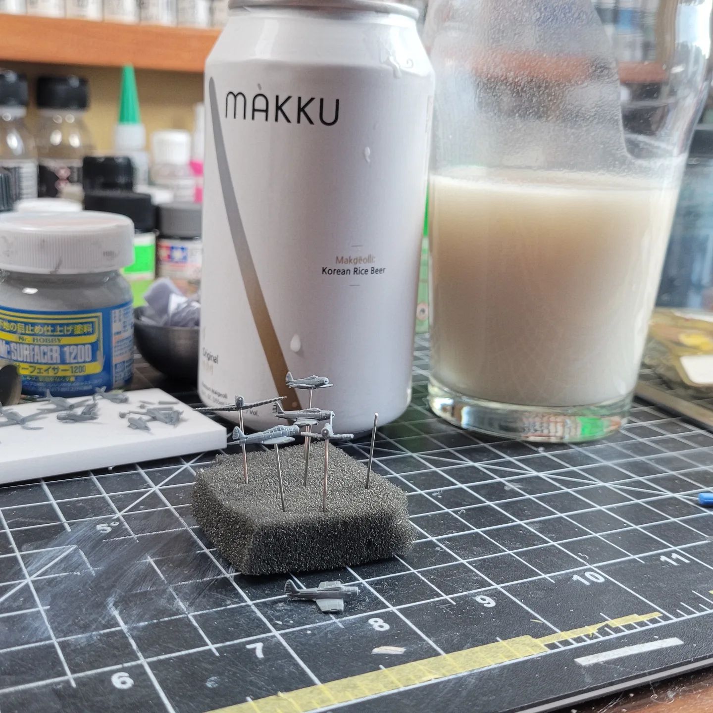I'm awaiting a new airbrush, so I've switched from working on Emterprise herself, to more effort on her airgroup. Small gaps to be filled, so Mr Surfacer to the rescue. The beer is Korean rice beer, which is very white, but quite nice. I wouldn't really classify it as beer, rather more of a carbonated, unfiltered, sake. Unique.
